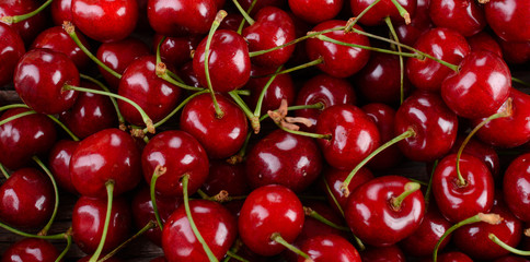 Ripe cherries on wooden table