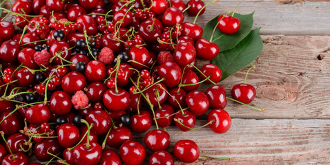 Ripe cherries on wooden table