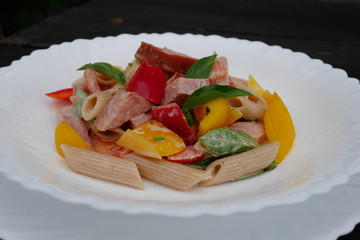   penne pasta salad, penne pasta with chicken ,peel tomatoes  ,bell peppers, basil,  dressed with a mayonnaise sauce...fresh and delicious dish. 