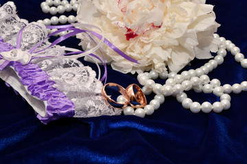 Two wedding rings and Peony flower.