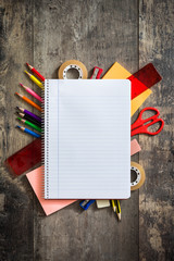 School supplies on wooden background. Back to school concept. Copyspace.

