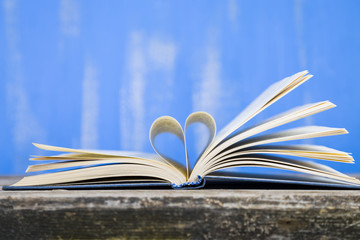 Open book on a wooden table