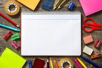 School supplies on wooden background. Back to school concept. Copyspace.

