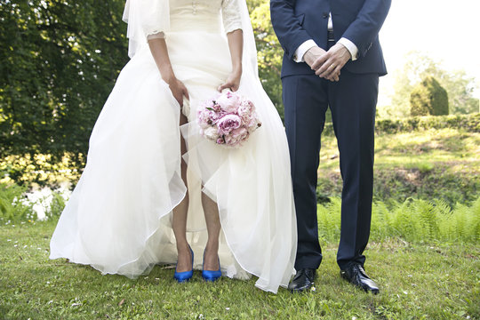 Legs of a wedding couple 