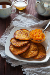 Pumpkin pancakes with honey and tea
