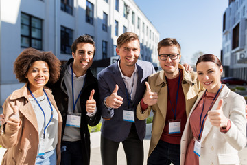 business team with conference badges in city