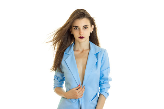 Pretty young business woman in blue jacket without bra under it