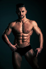 Obraz na płótnie Canvas sexy man with muscular body in underwear pants