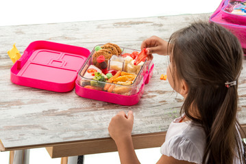 preparing lunch for child school top view on white background