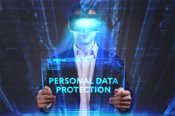 Business, Technology, Internet and network concept. Young businessman working in virtual reality glasses sees the inscription: Personal data protection
