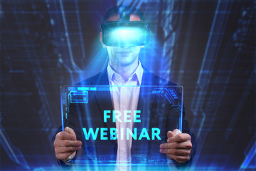 Business, Technology, Internet and network concept. Young businessman working in virtual reality glasses sees the inscription: Free webinar