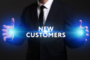 Business, Technology, Internet and network concept. Young businessman working on a virtual screen of the future and sees the inscription: New customers