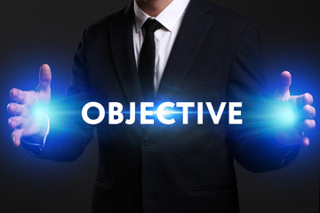 Business, Technology, Internet and network concept. Young businessman working on a virtual screen of the future and sees the inscription: Objective