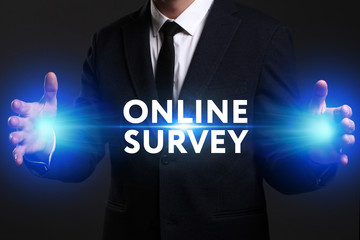 Business, Technology, Internet and network concept. Young businessman working on a virtual screen of the future and sees the inscription: Online survey