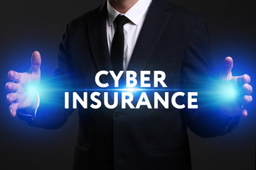 Business, Technology, Internet and network concept. Young businessman working on a virtual screen of the future and sees the inscription: Cyber insurance