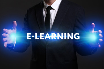Business, Technology, Internet and network concept. Young businessman working on a virtual screen of the future and sees the inscription: E-learning