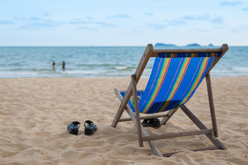 armchair on beach in summer time