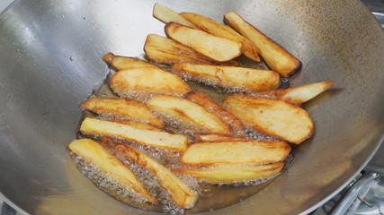 French fries is scorch cooking in hot pan