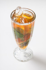 Tea with ice lemon and mint on a white background