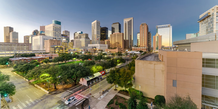 Aerial View Downtown Houston Illuminated At Twilight With Green City Park And Modern Skylines Light. The Most Populous City In Texas, Fourth-most In United States. Architecture And Travel Background.