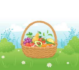 Bamboo basket with natural and organic food. Picnic basket with vegetables and fruits on grass. Healthy living concept.