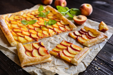 Delicious puff pastry pie topped with sliced peach