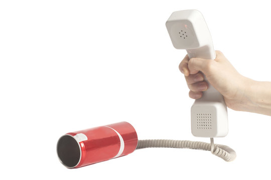Hand holding white telephone tube and red tin can phone isolated on white.Communication concept