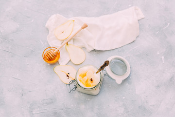 home sweet yogurt with pear  in a glass jar