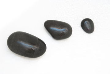 Spa treatment background of pebbles and running water