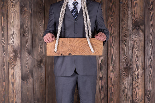 Businessman with a wooden frame