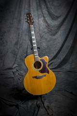 acustic guitar on stand in studio