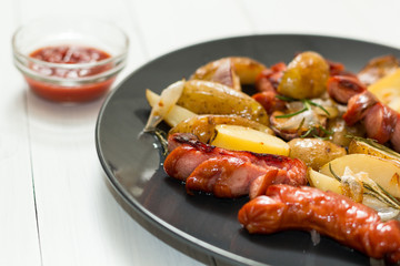 Fried potatoes with sausage on a plate