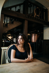 Fototapeta na wymiar beautiful young woman resting in a cafe