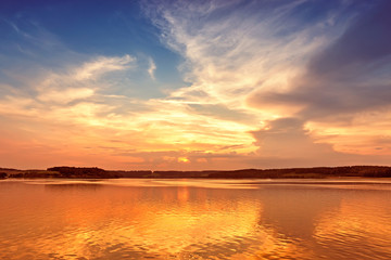 Fototapeta na wymiar sunset over lake with colorful sky background.