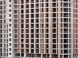 Monolithic frame construction on facade - building under construction.