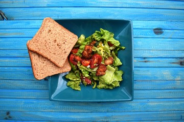 Fresh vegetable salad, healthy food, tomatoes and salad leaves. Healthy chicken salad with fresh...