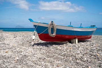 Fishing boat raised to the beach