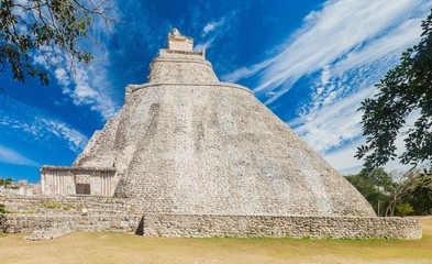 Fototapeta na wymiar Pyramid of the Magician (Piramide del adivino) in ancient Mayan city Uxmal, Mexico
