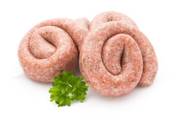 Raw sausages with herbs and spices.