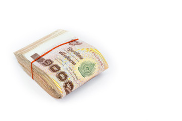 Thai money currency, Stack of one thousand baht banknotes isolated on white background.