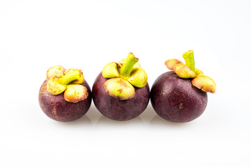 Mangosteen cut off one side on wooden background.