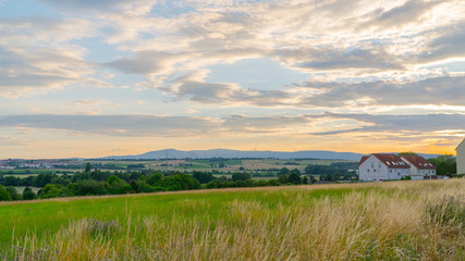 Beautiful sunset over a field and a small town in Germany.
