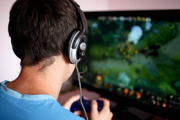 Man hand playing a computer games