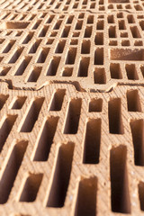 Red bricks material for building construction, close up