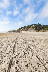 Tire tracks on the beach