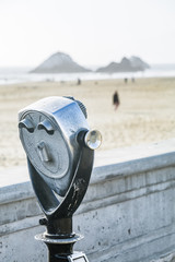 coin operated binoculars with beach view