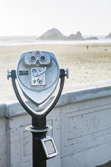 coin operated binoculars with beach view