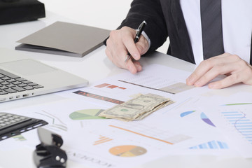 Business man working on desk, checking documents