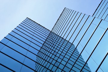 Fototapeta na wymiar Glass Shrouded Building - Modern Structure.