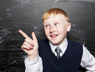 Boy near blackboard